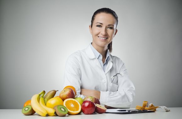 female-nutritionist-with-fruits-and-veggies
